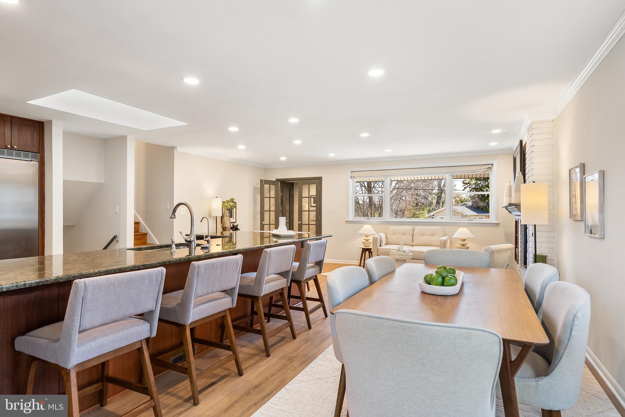 6417 Tone Drive Bethesda, MD 20817 - Photo 14 of 50 a view of a dining room with furniture and a potted plant