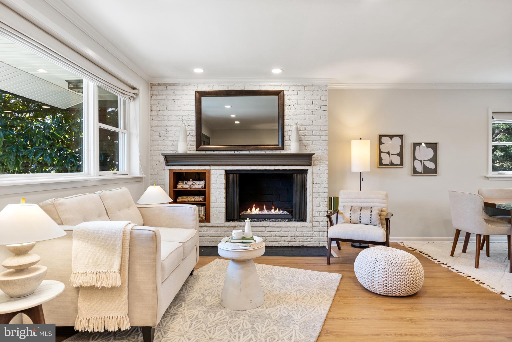 6417 Tone Drive Bethesda, MD 20817 - Photo 16 of 50 a living room with furniture a flat screen tv and a fireplace
