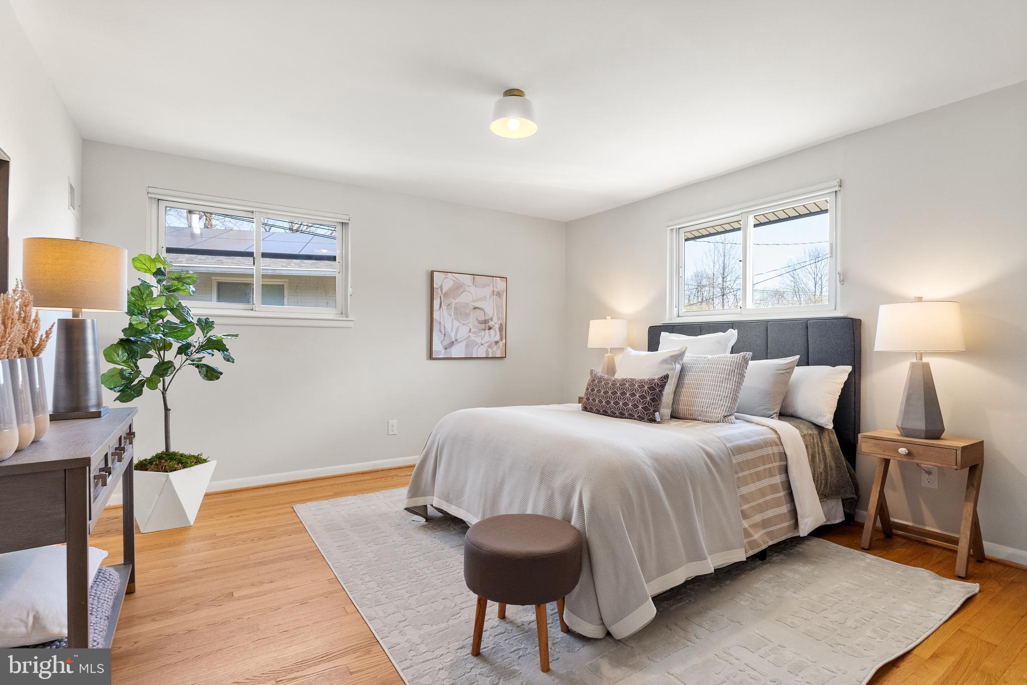 6417 Tone Drive Bethesda, MD 20817 - Photo 23 of 50 a bedroom with a bed and a potted plant