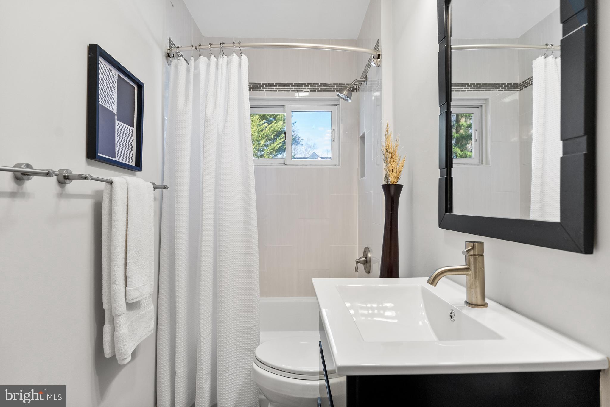 6417 Tone Drive Bethesda, MD 20817 - Photo 24 of 50 a bathroom with a sink toilet and shower