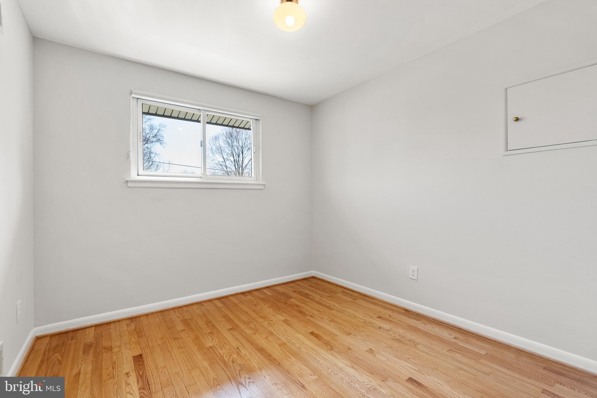6417 Tone Drive Bethesda, MD 20817 - Photo 27 of 50 a view of empty room with wooden floor