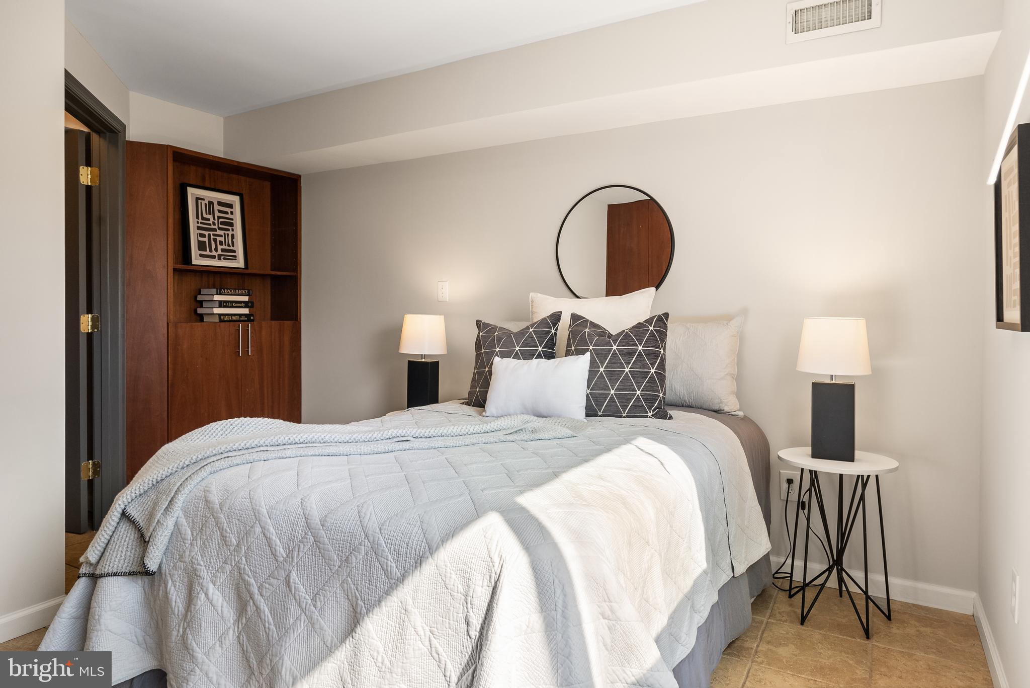 6417 Tone Drive Bethesda, MD 20817 - Photo 30 of 50 a bedroom with a bed and a lamp