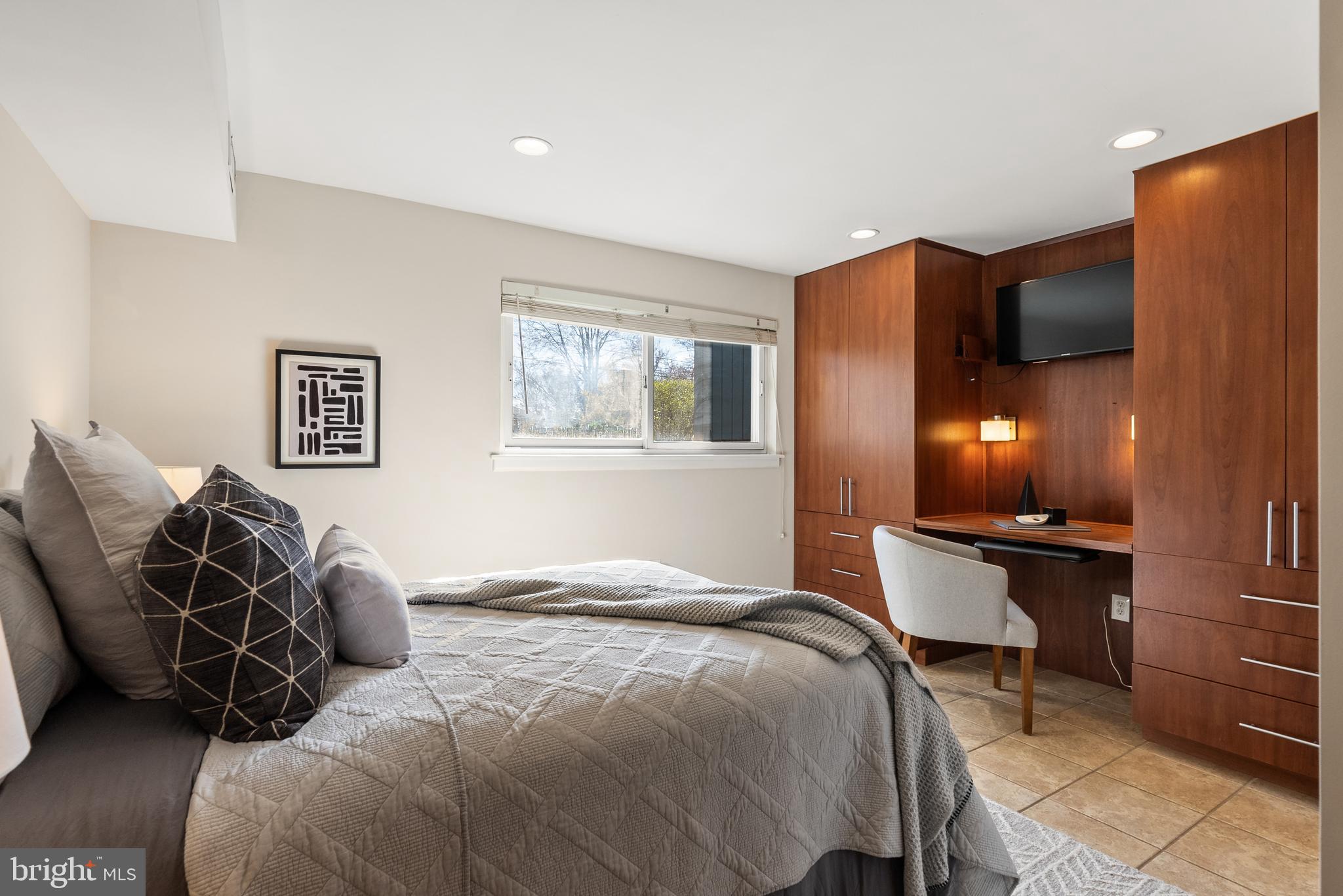 6417 Tone Drive Bethesda, MD 20817 - Photo 31 of 50 a bedroom with a bed and wooden floor