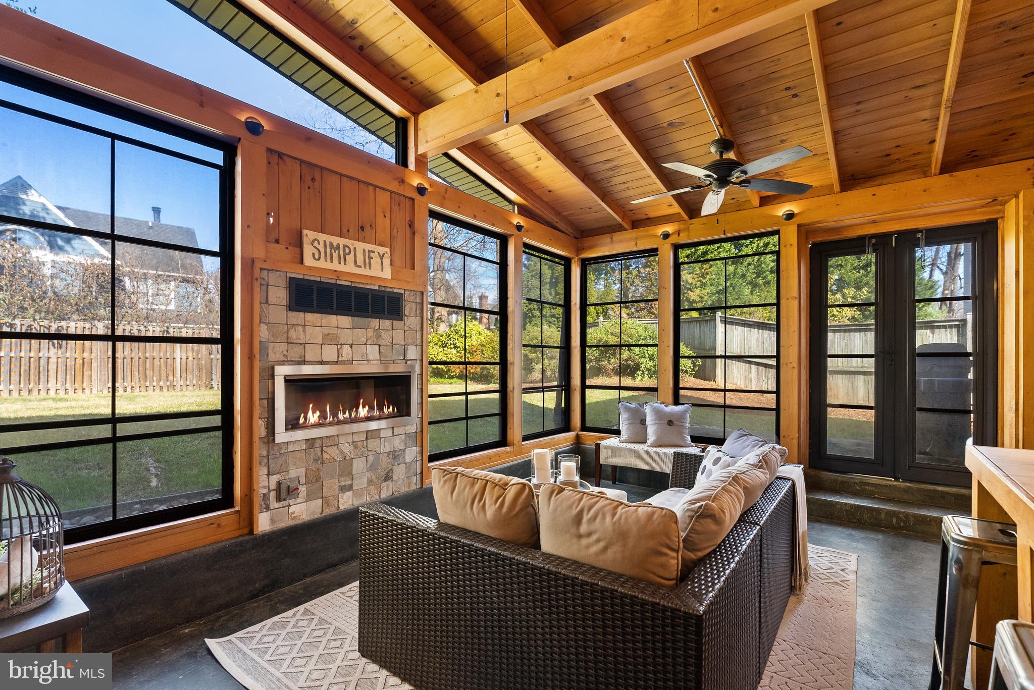 6417 Tone Drive Bethesda, MD 20817 - Photo 33 of 50 a living room with furniture and a floor to ceiling window
