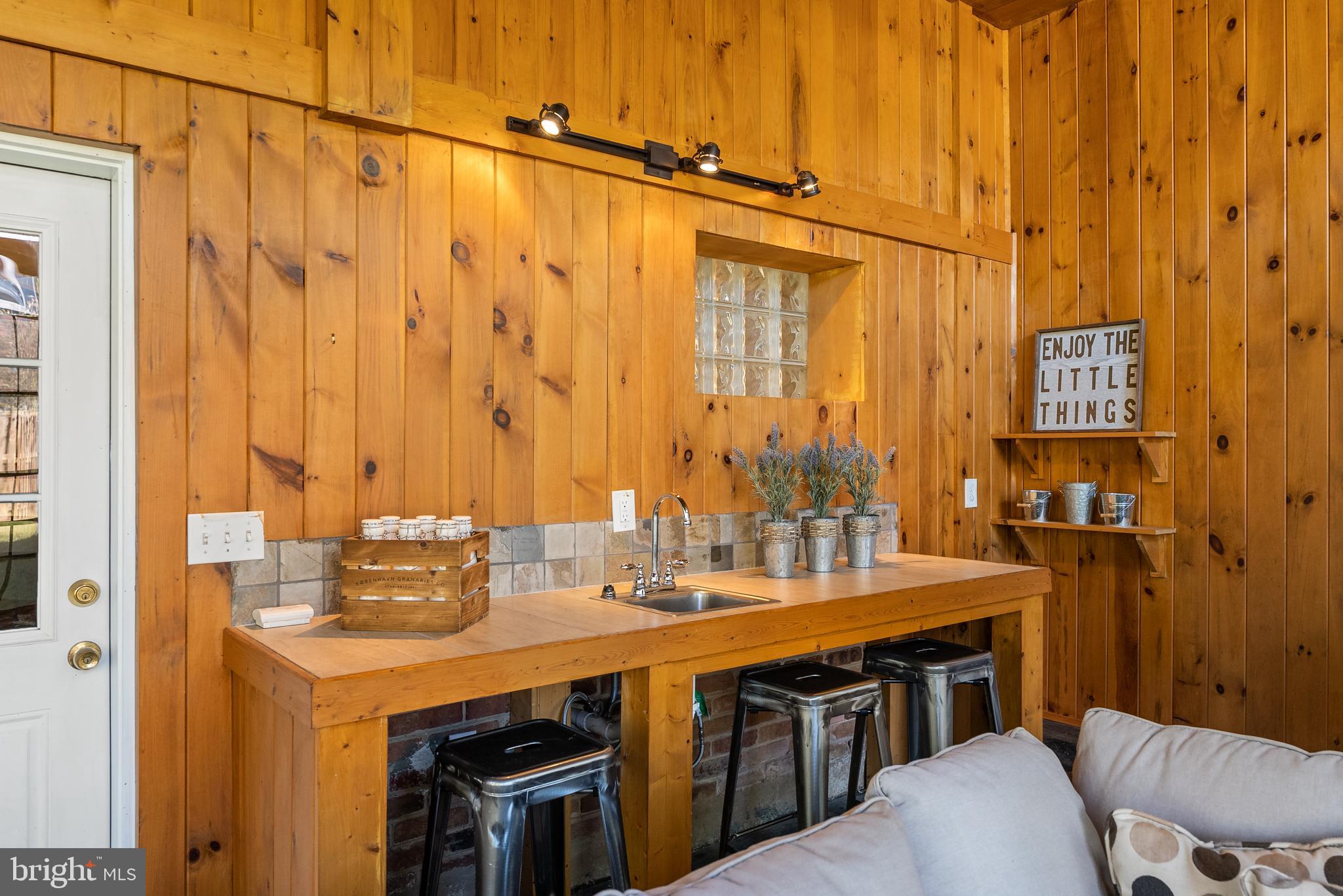 6417 Tone Drive Bethesda, MD 20817 - Photo 37 of 50 a bathroom with a double vanity sink and a mirror