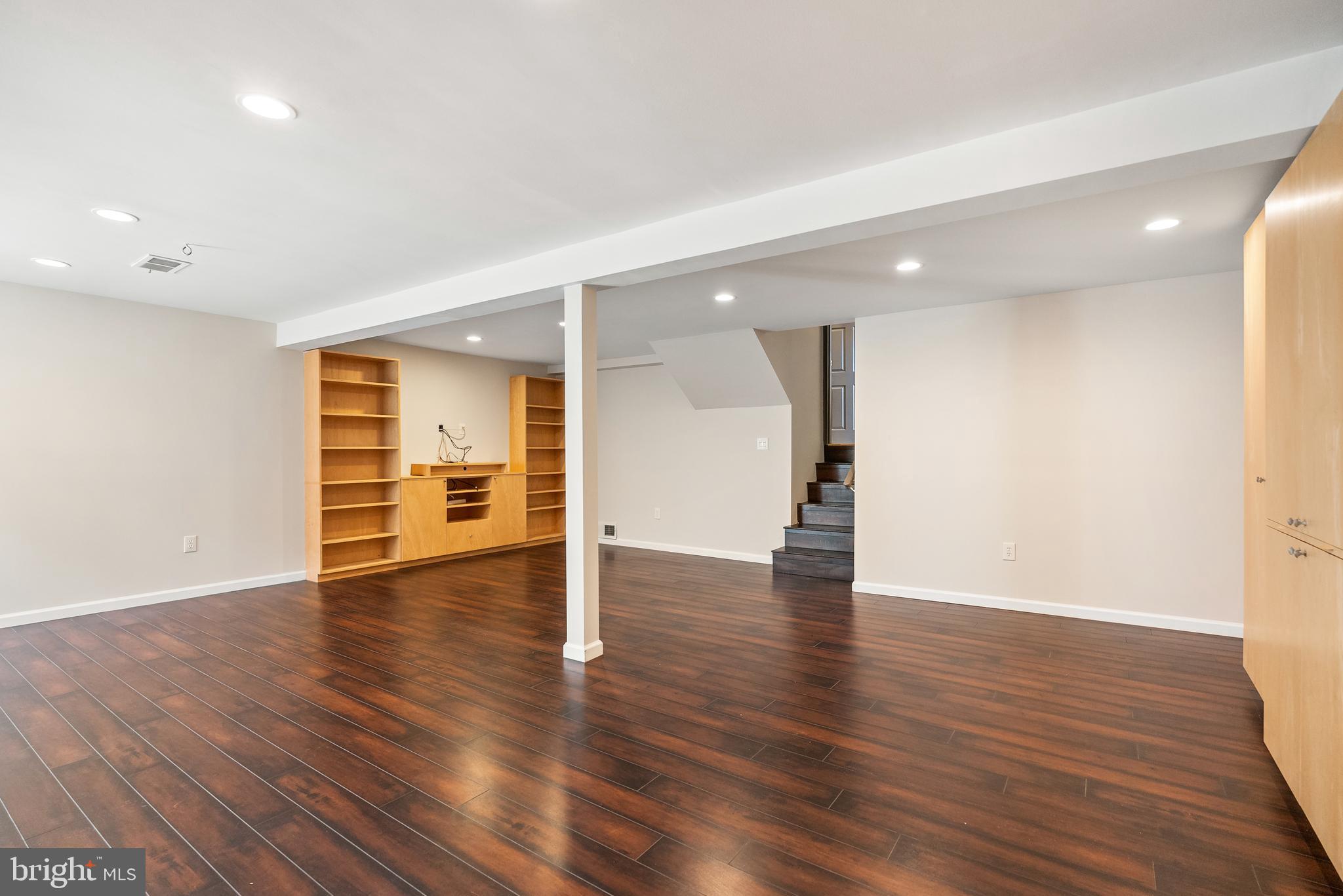 6417 Tone Drive Bethesda, MD 20817 - Photo 40 of 50 a view of empty room with wooden floor