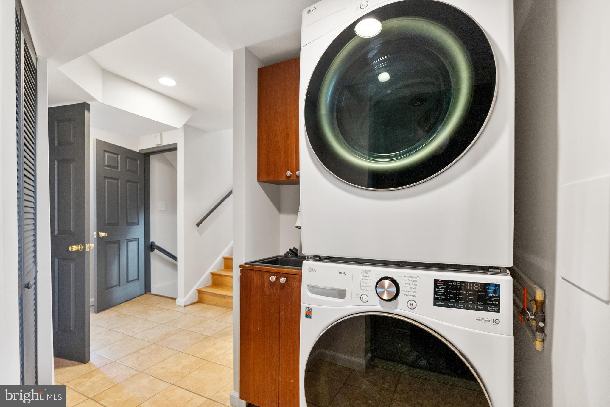 6417 Tone Drive Bethesda, MD 20817 - Photo 43 of 50 a view of entryway with washer and dryer