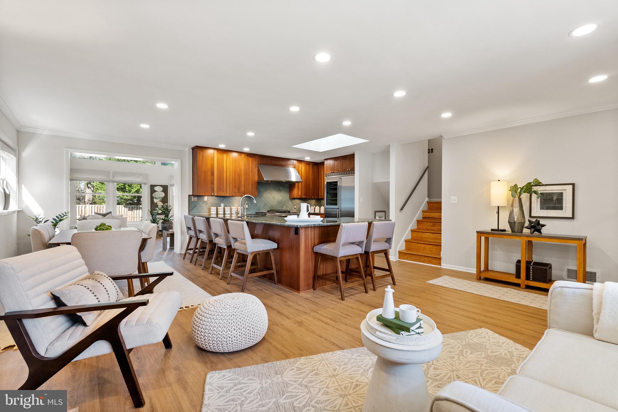 6417 Tone Drive Bethesda, MD 20817 - Photo 5 of 50 a living room with furniture and a dining table with kitchen view