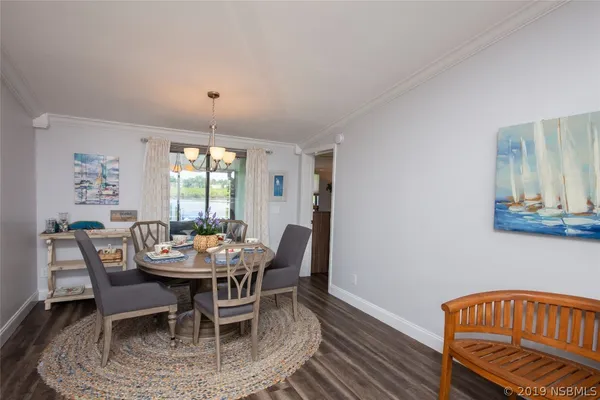 a dining room with furniture and window