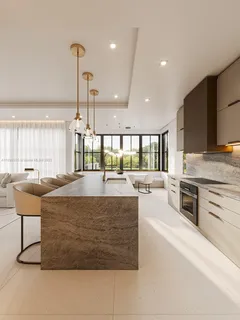 a large kitchen with stainless steel appliances granite countertop a stove and a sink