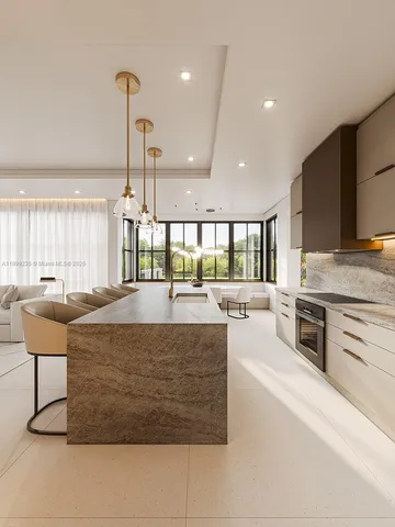 a large kitchen with stainless steel appliances granite countertop a stove and a sink