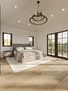 a bedroom with a large bed and a chandelier