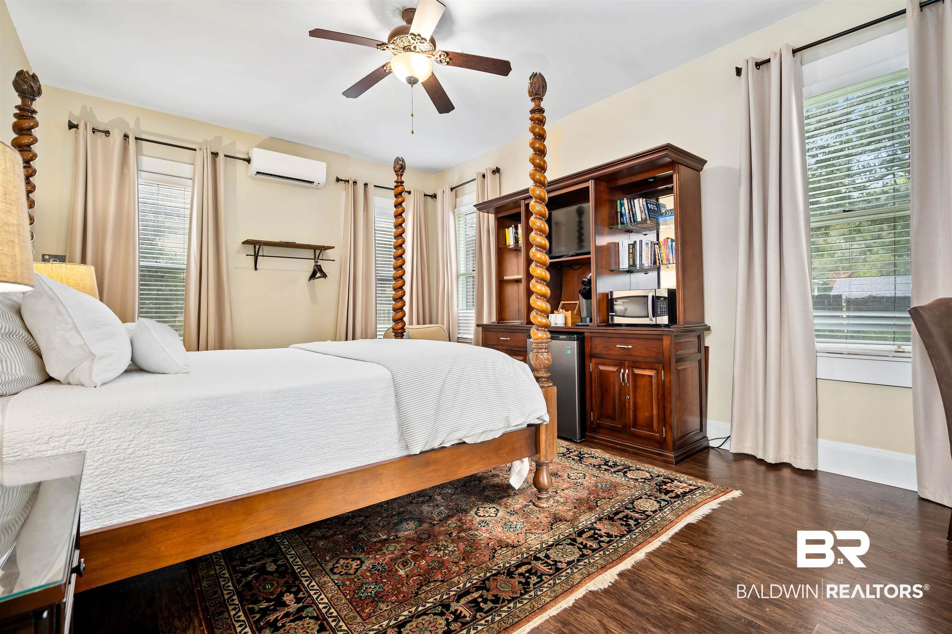 1314 Dauphin Street Mobile, AL 36604 - Photo 52 of 61 Bedroom featuring multiple windows, ceiling fan, and dark wood-type flooring