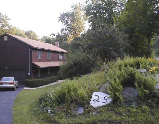 25 Good Hill Road Oxford, CT 06478 - Photo 1 of 1 a front view of a house with a yard