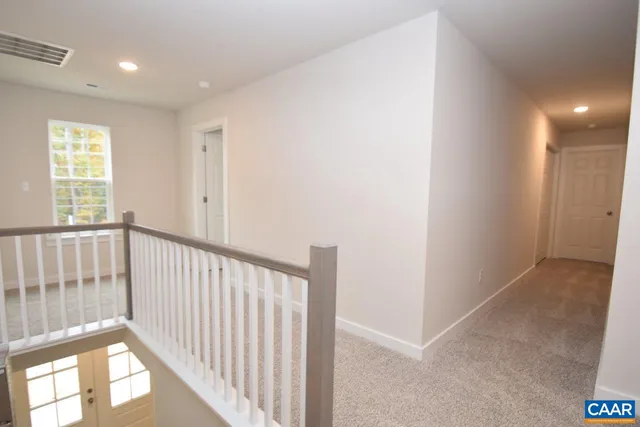a view of hallway with windows