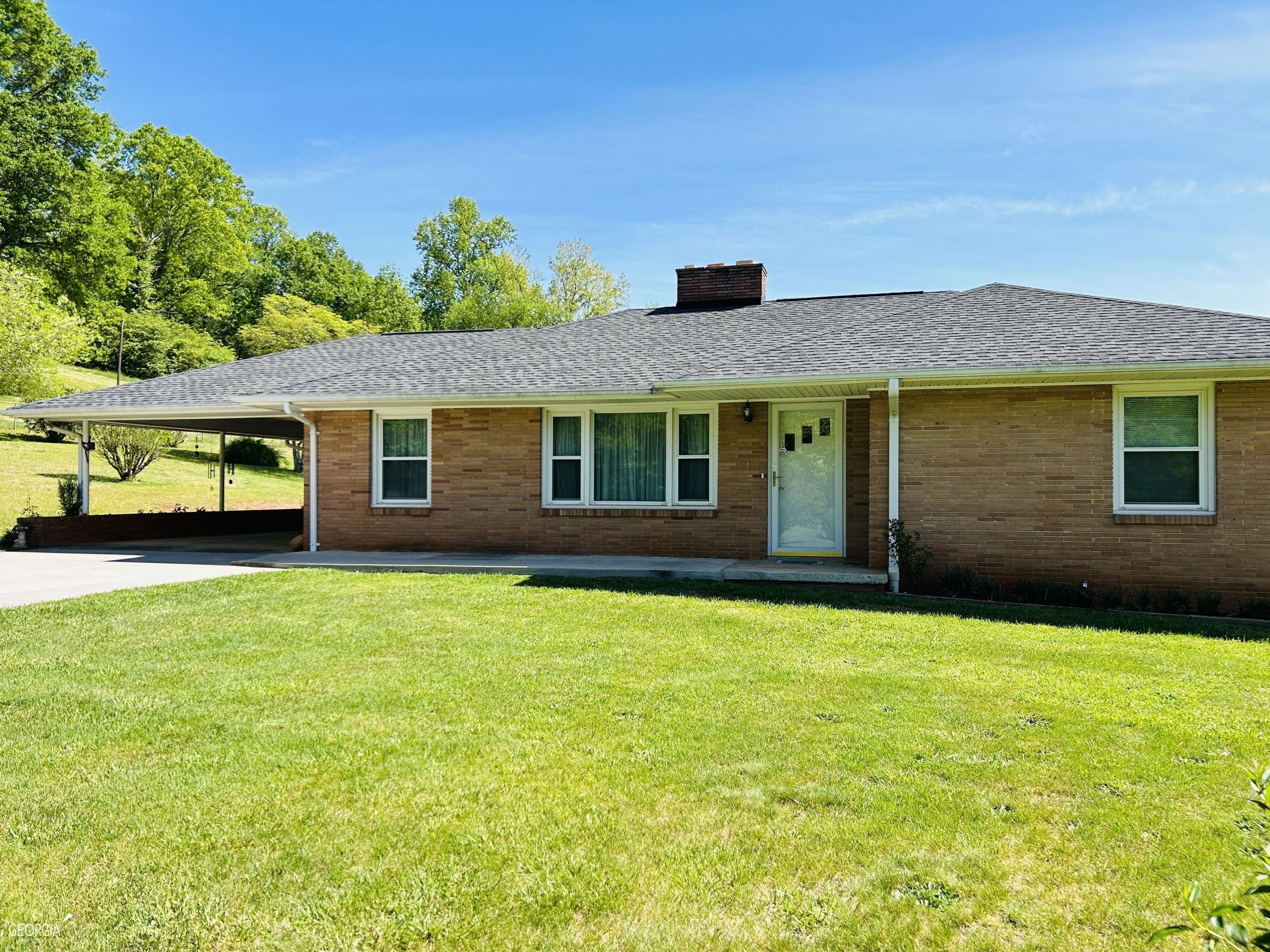 376 Trotter Road Clarkesville, GA 30523 - Photo 1 of 1 a front view of a house with a garden
