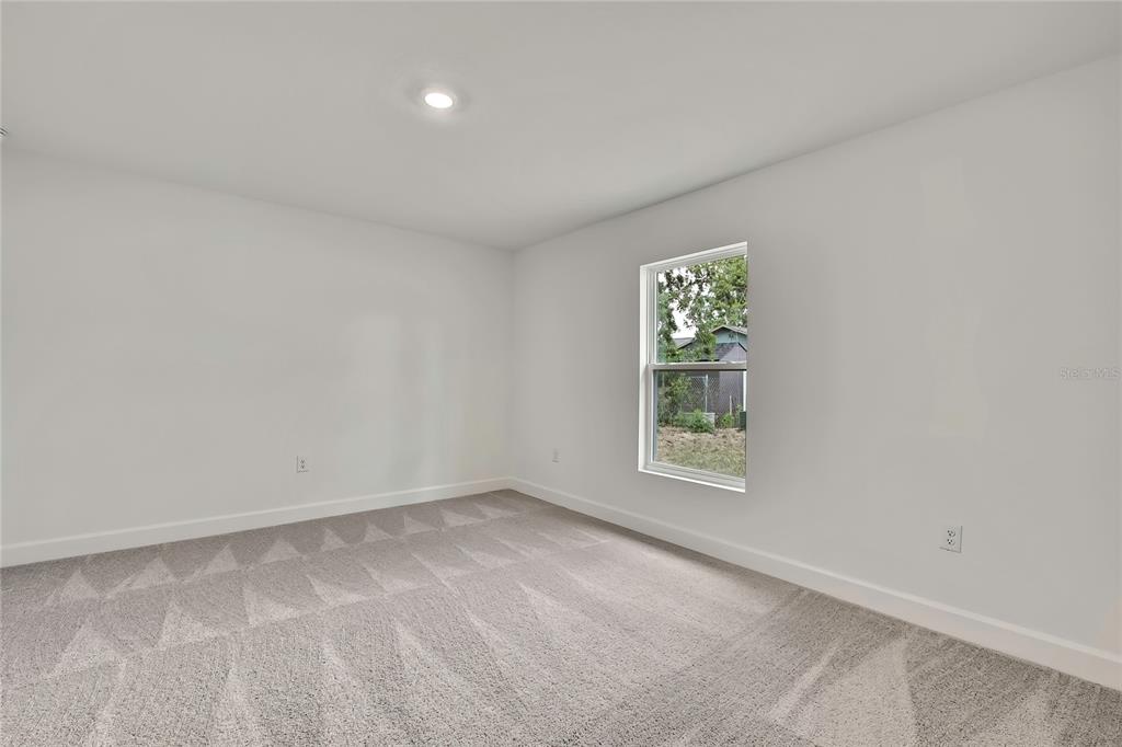 3646 Portillo Road Spring Hill, FL 34608 - Photo 6 of 16 an empty room with windows