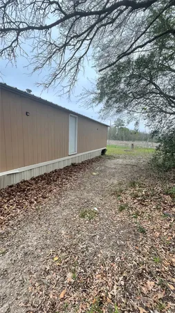 a view of a yard with a tree