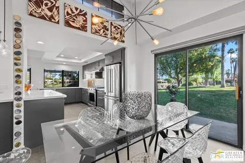 a view of a dining room with furniture window and outside view