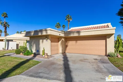 a front view of a house with a garage
