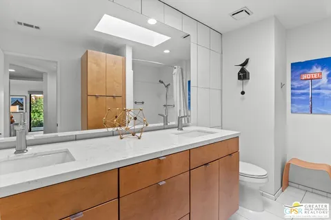 a view of storage and utility room with washer and dryer
