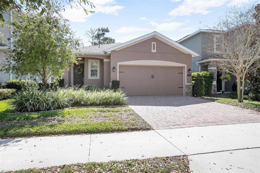 1343 Riley Circle DeLand, FL 32724 - Photo 1 of 1 a front view of a house with a yard and garage