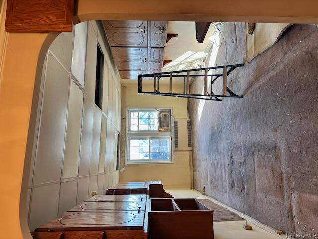 15 Gaynor Avenue, Unit 2H Manhasset, NY 11030 - Photo 4 of 7 Unfurnished bedroom with carpet floors, radiator heating unit, and a drop ceiling