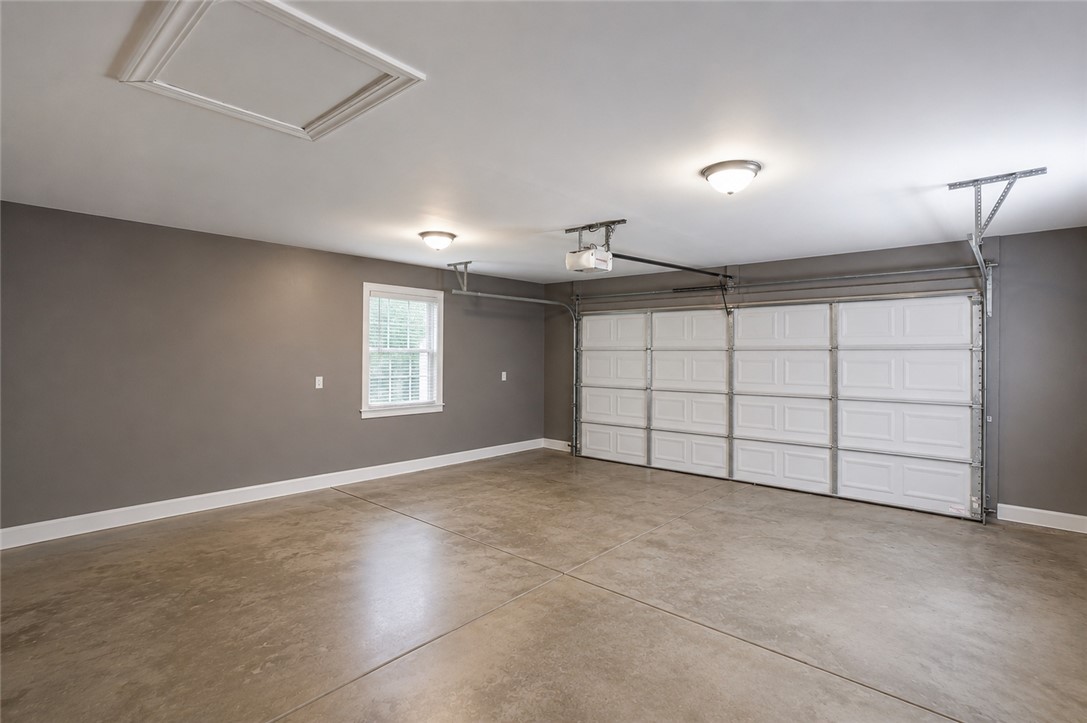 842 Conneross Road Townville, SC 29689 - Photo 24 of 34 Secure parking is provided in this clean garage with ample overhead lighting.