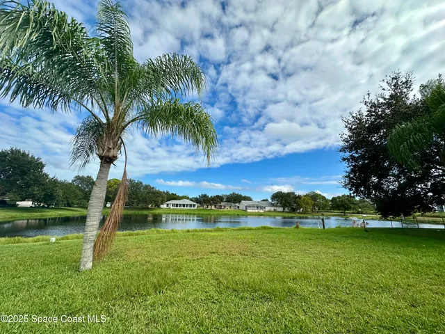 a view of a lake with a big yard