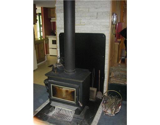 260 Maple Road Burgettstown, PA 15021 - Photo 4 of 13 Living Room. Log burning stove in living room