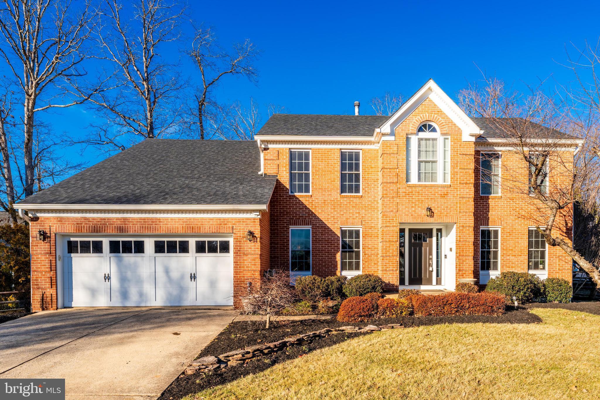 a front view of a house with yard