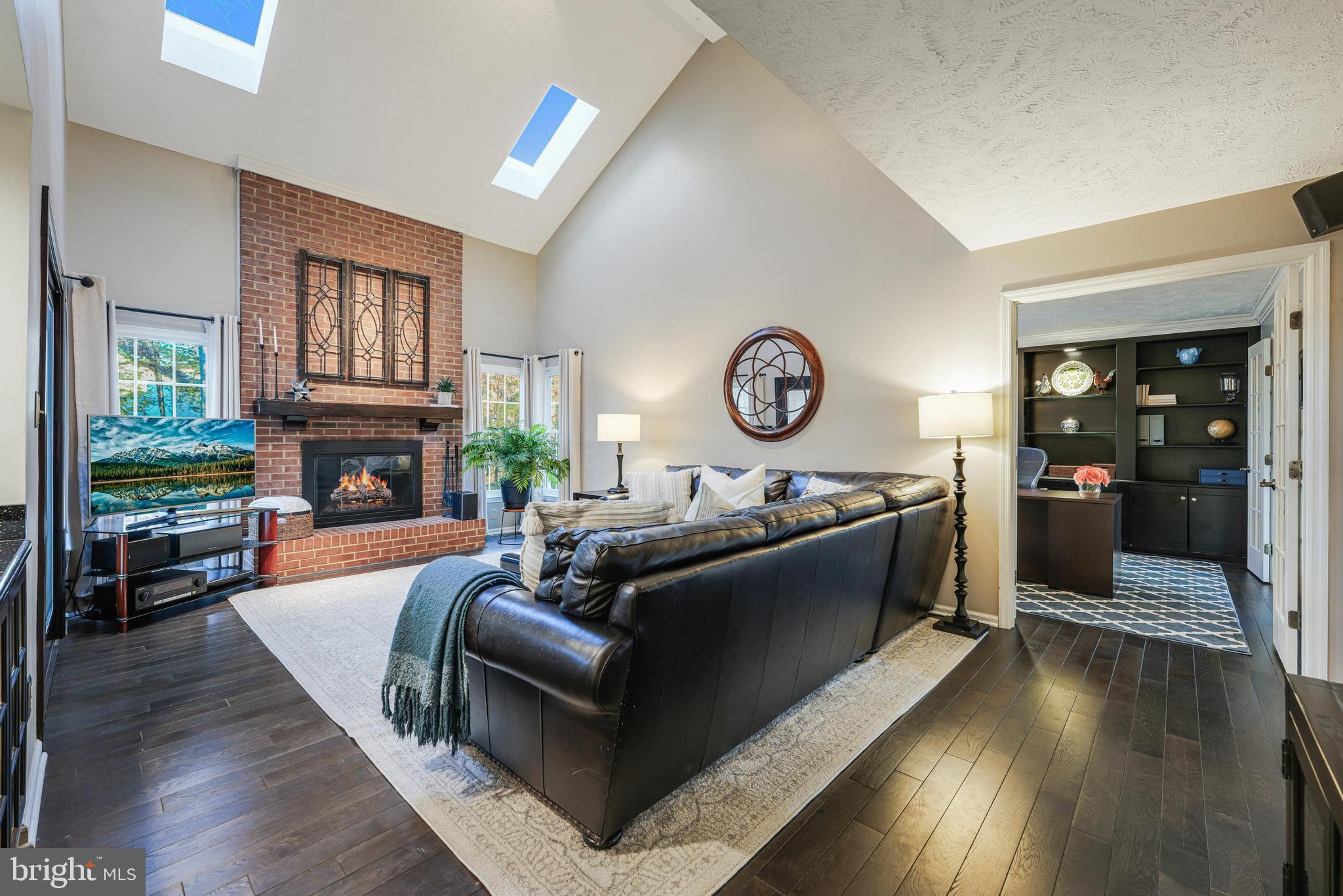 6900 Confederate Ridge Lane Centreville, VA 20121 - Photo 11 of 69 a living room with fireplace furniture and a wooden floor