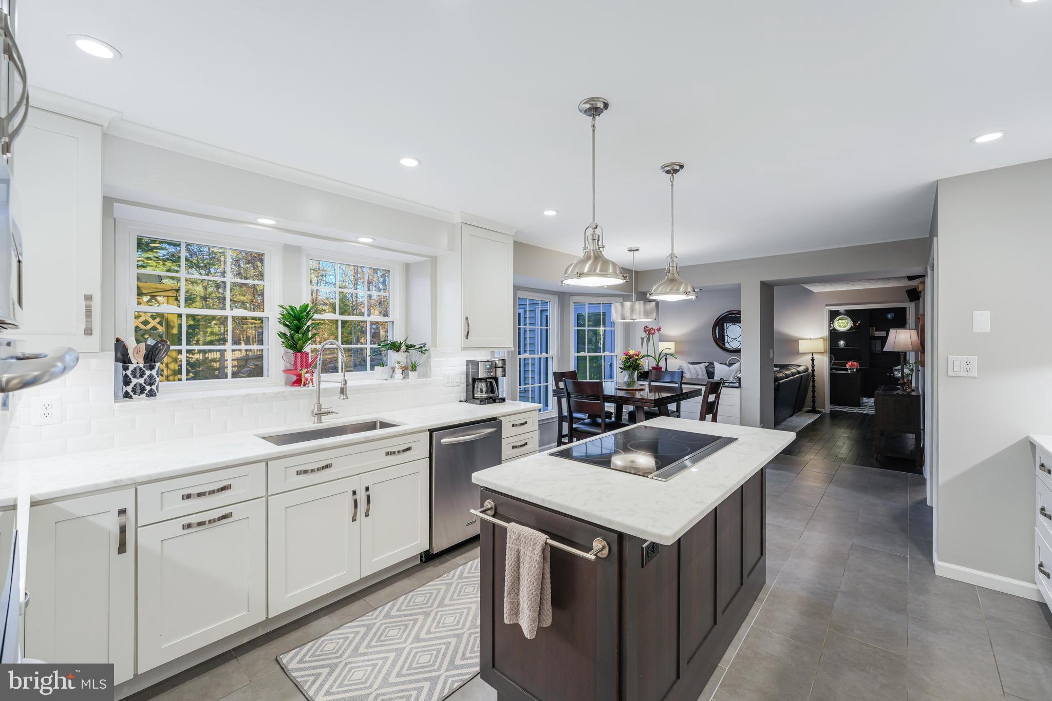 6900 Confederate Ridge Lane Centreville, VA 20121 - Photo 15 of 69 a kitchen that has a lot of cabinets in it and wooden floors
