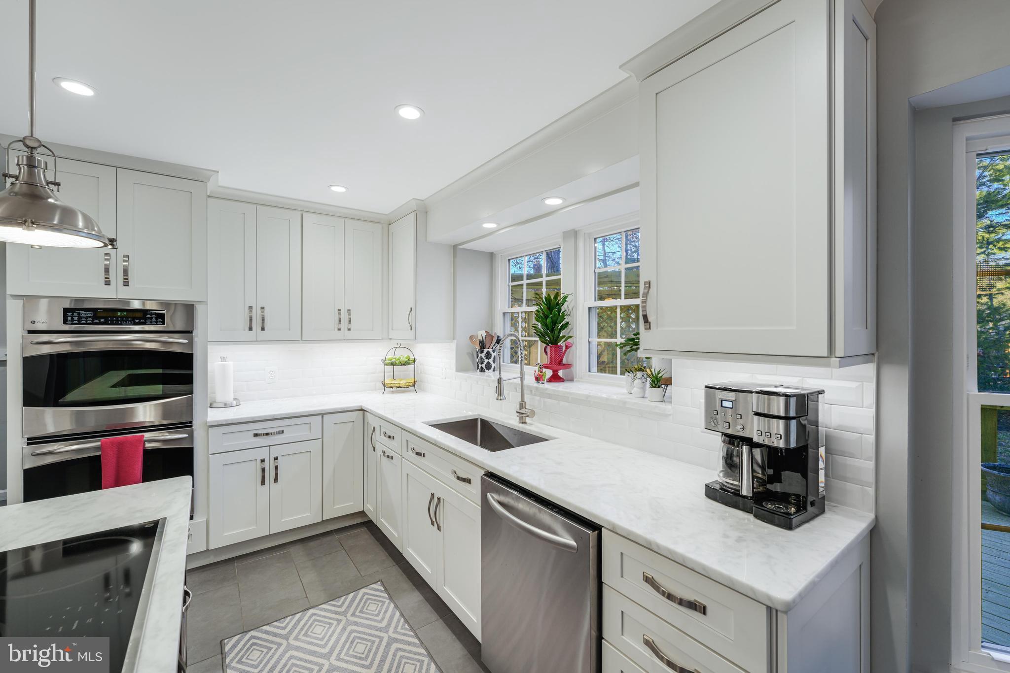 6900 Confederate Ridge Lane Centreville, VA 20121 - Photo 17 of 69 a kitchen with a sink stainless steel appliances and cabinets
