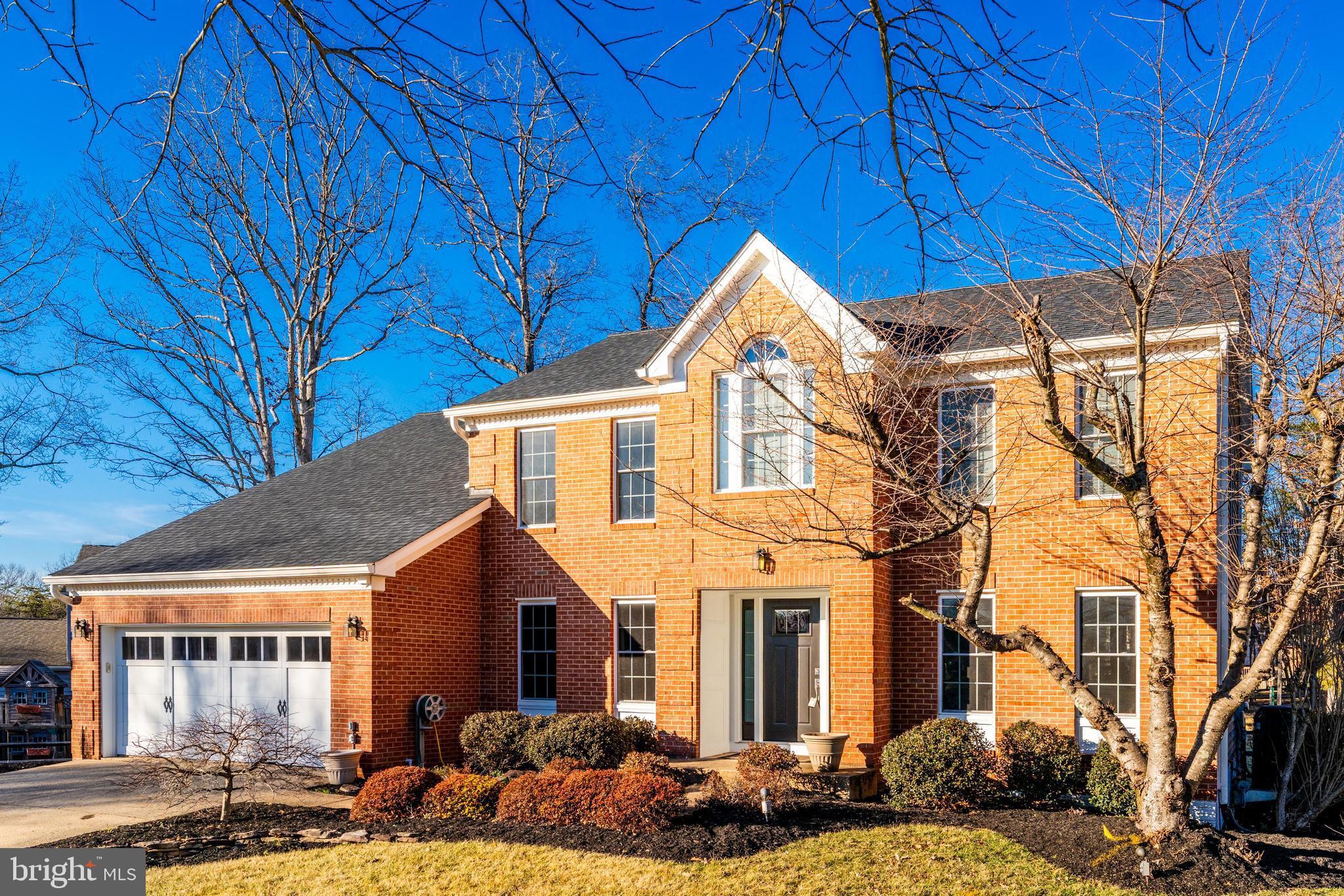 6900 Confederate Ridge Lane Centreville, VA 20121 - Photo 2 of 69 a front view of a house with a yard