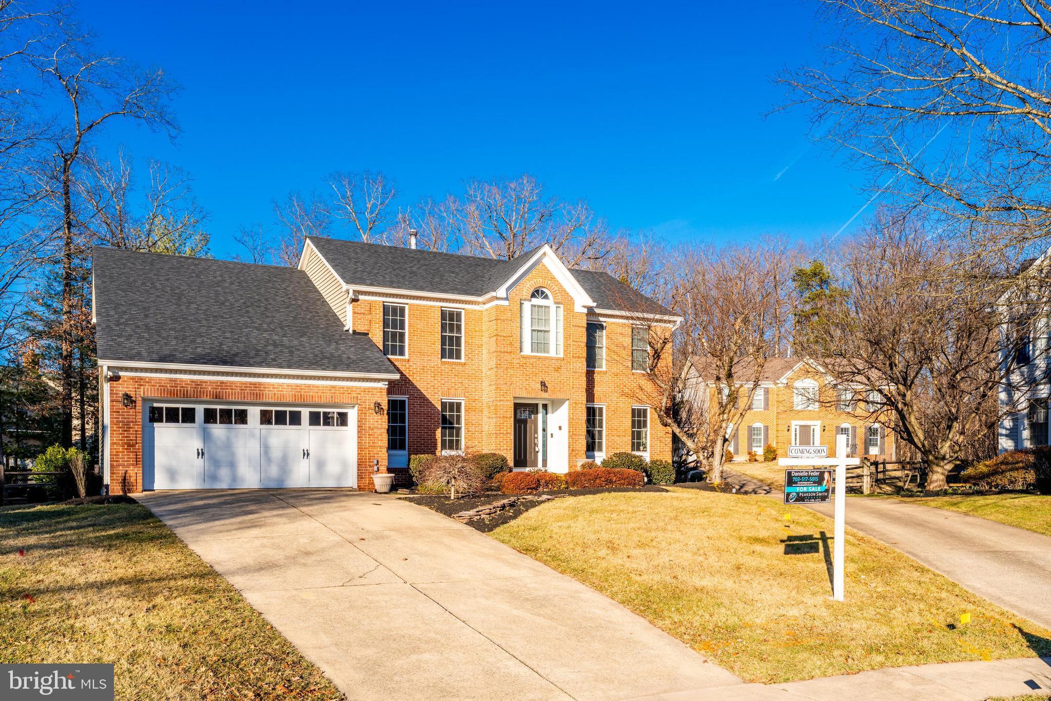 6900 Confederate Ridge Lane Centreville, VA 20121 - Photo 3 of 69 a front view of a house with a yard