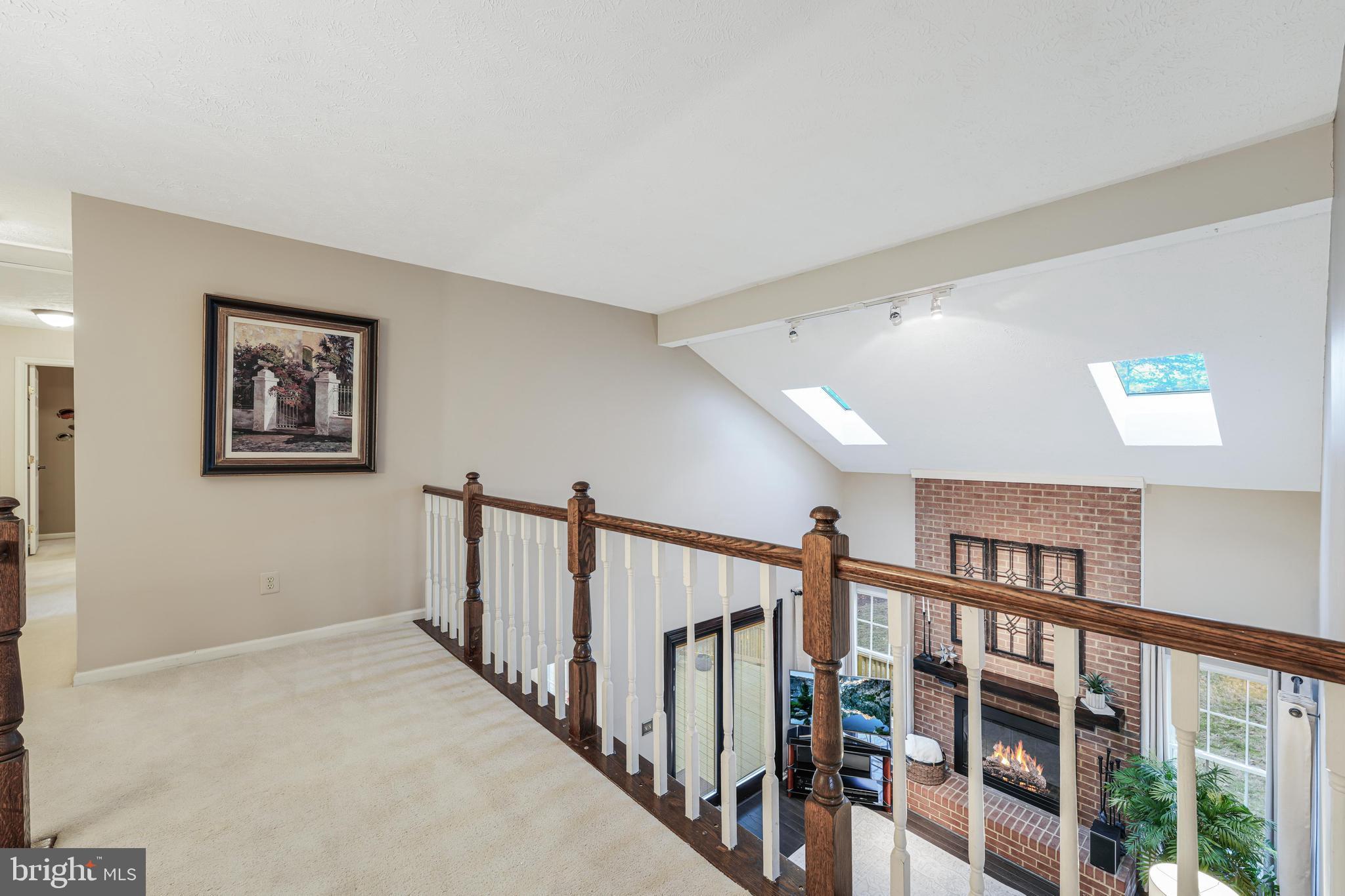 6900 Confederate Ridge Lane Centreville, VA 20121 - Photo 34 of 69 a view of staircase with lots of frames on wall and a large window
