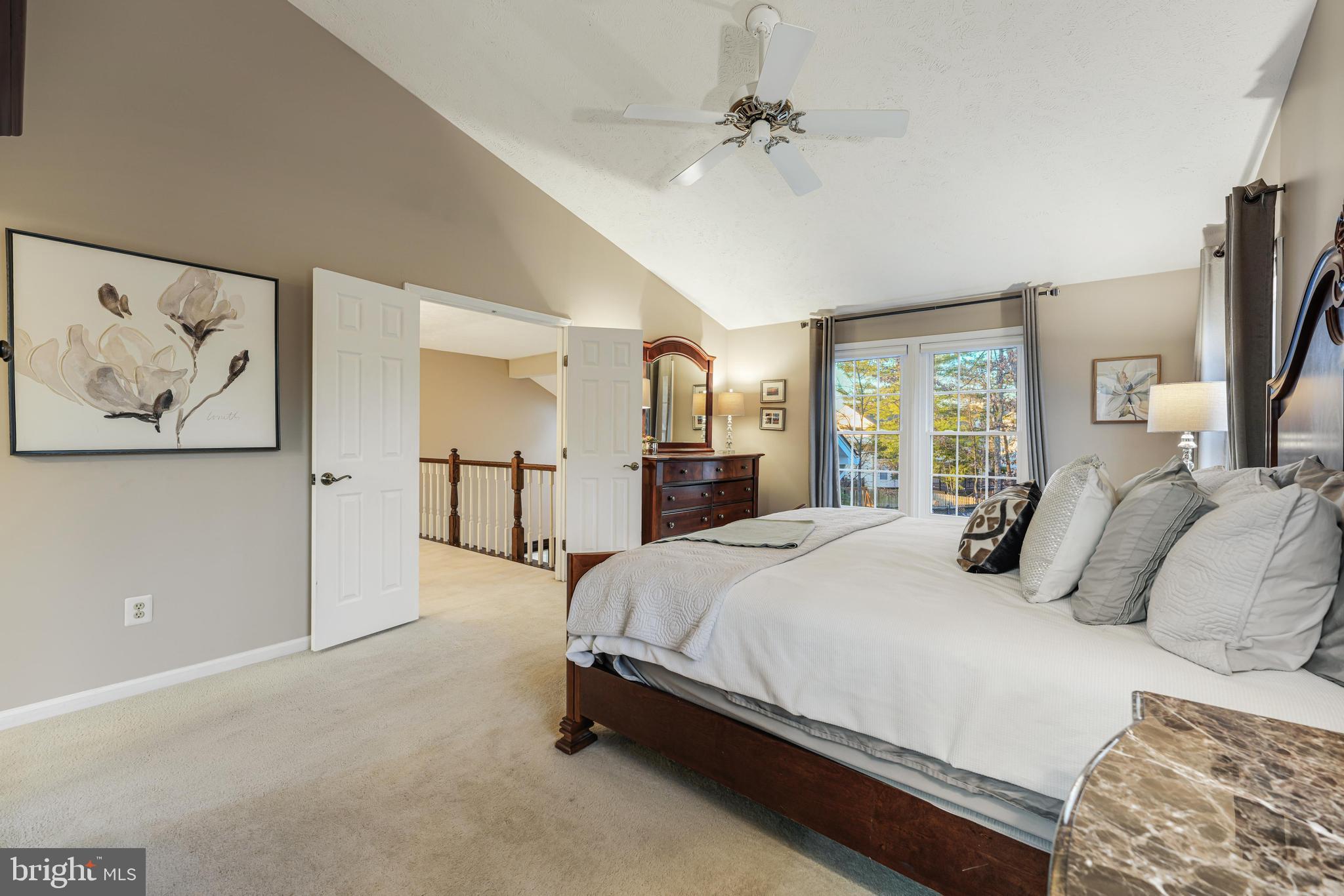 6900 Confederate Ridge Lane Centreville, VA 20121 - Photo 37 of 69 a bedroom with a large bed and a chandelier