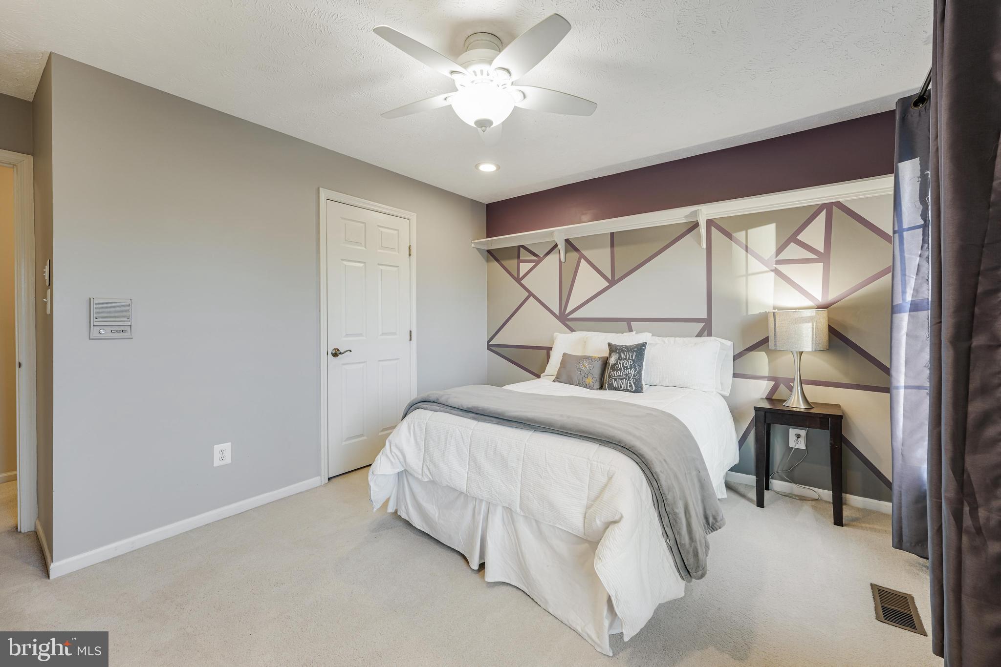 6900 Confederate Ridge Lane Centreville, VA 20121 - Photo 44 of 69 a bedroom with a bed and a ceiling fan
