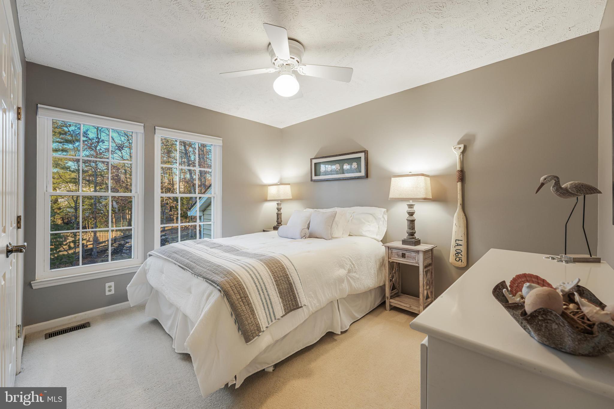 6900 Confederate Ridge Lane Centreville, VA 20121 - Photo 46 of 69 a spacious bedroom with two beds and a large window