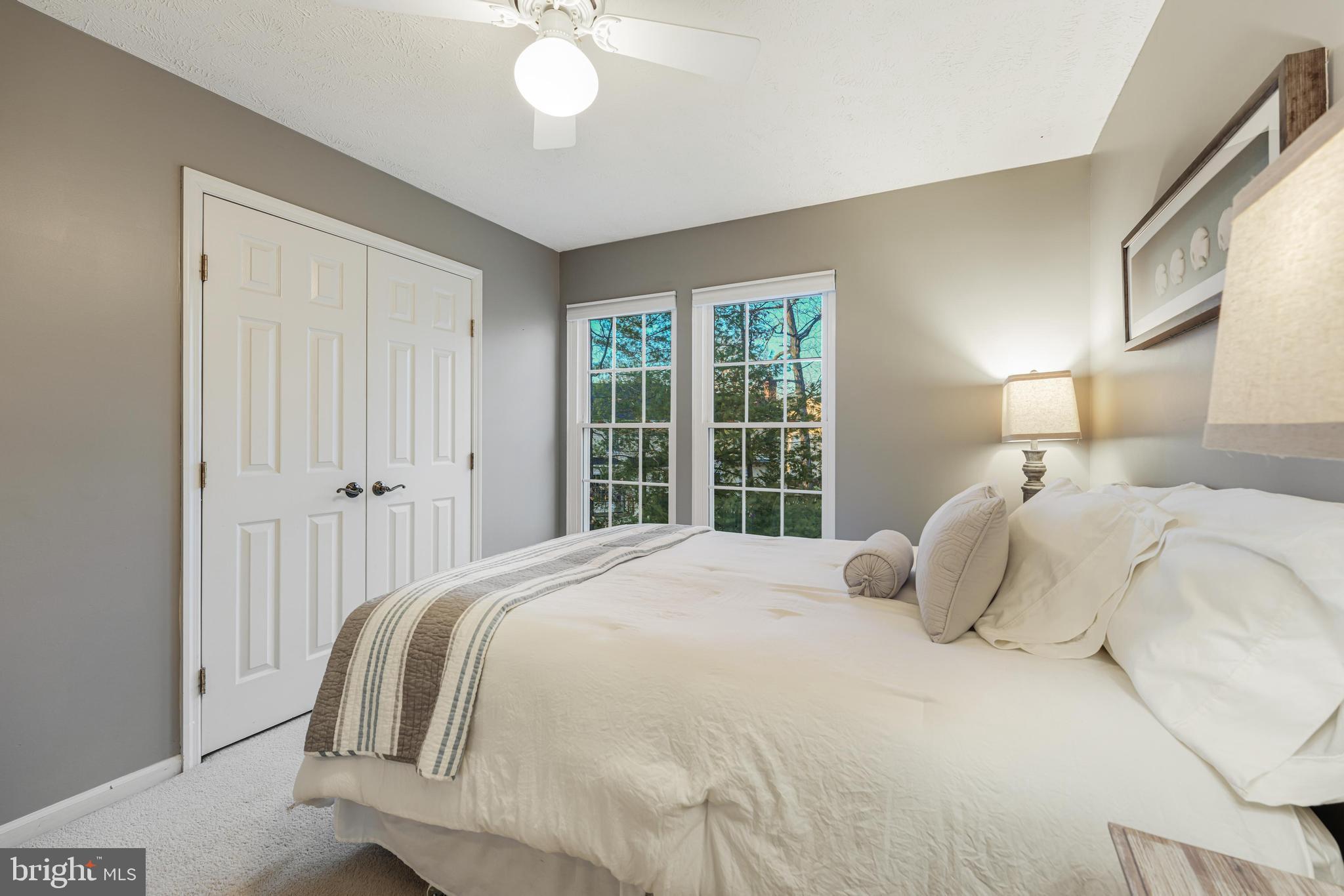 6900 Confederate Ridge Lane Centreville, VA 20121 - Photo 47 of 69 a bedroom with a large bed and a chandelier