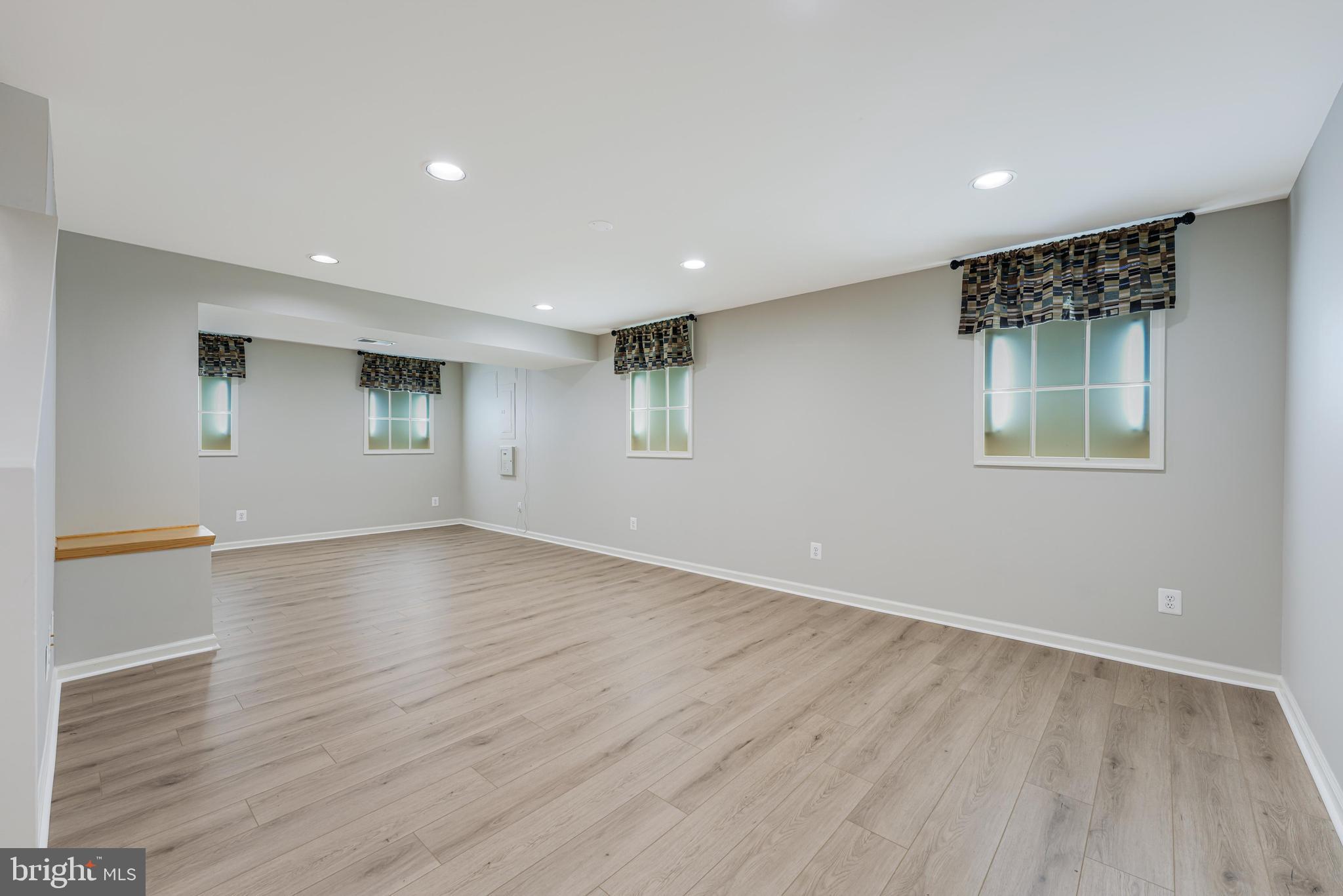 6900 Confederate Ridge Lane Centreville, VA 20121 - Photo 53 of 69 a view of an empty room with wooden floor and a window