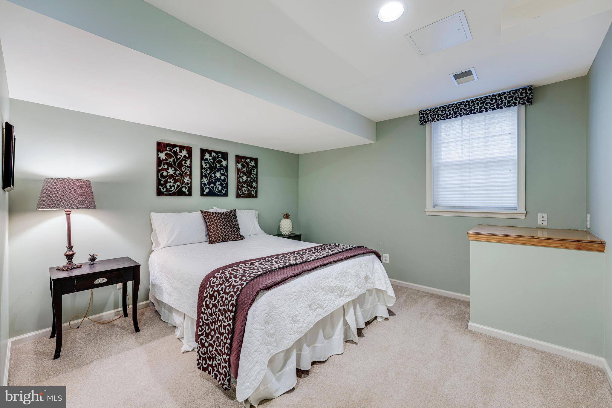 6900 Confederate Ridge Lane Centreville, VA 20121 - Photo 57 of 69 a bedroom with a bed and a window