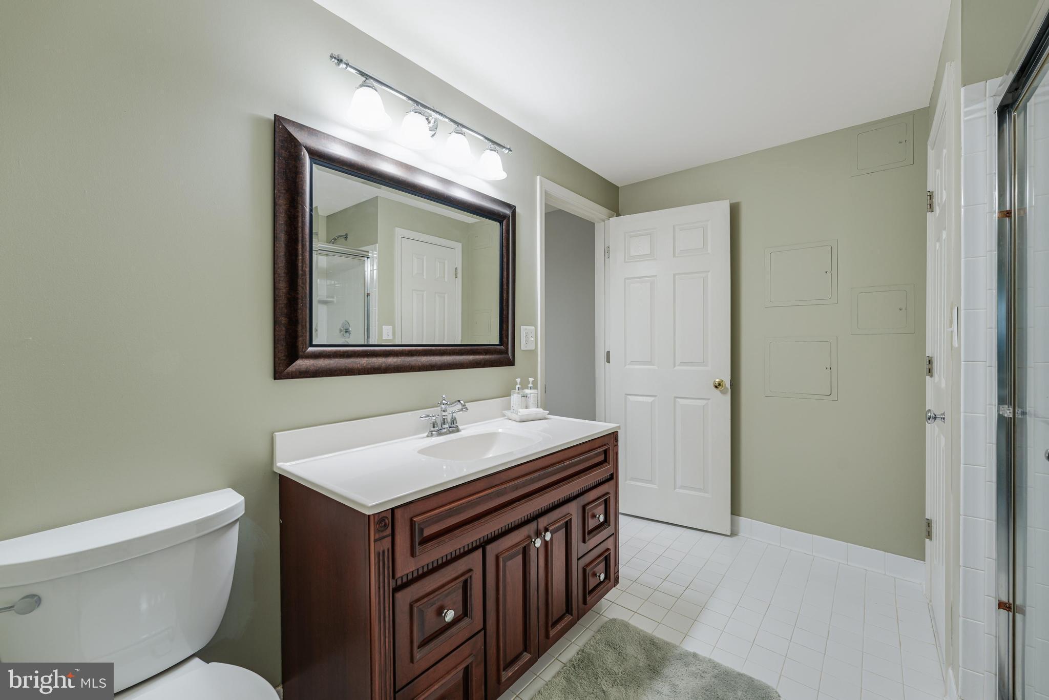 6900 Confederate Ridge Lane Centreville, VA 20121 - Photo 58 of 69 a bathroom with a sink and a mirror