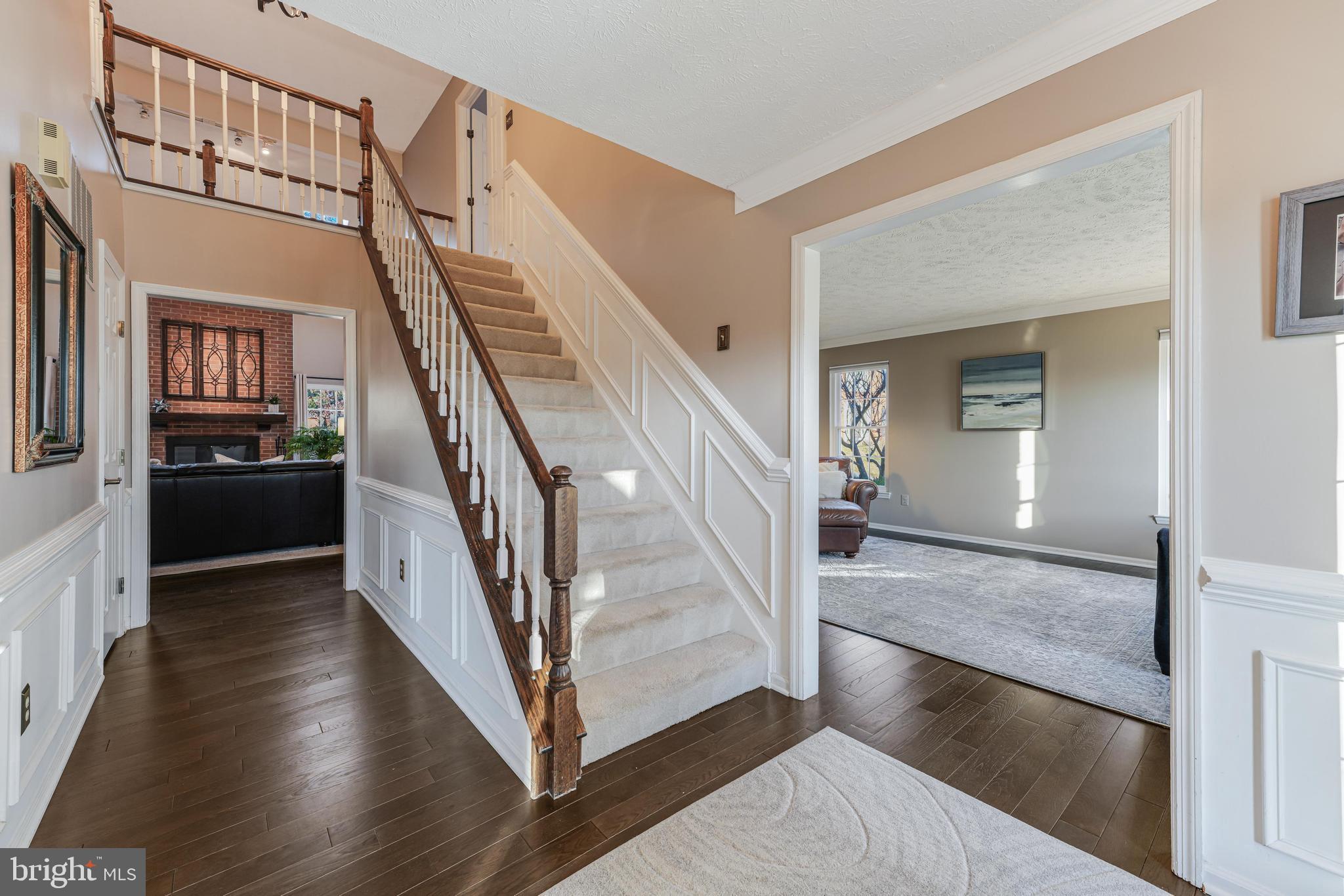 6900 Confederate Ridge Lane Centreville, VA 20121 - Photo 6 of 69 a view of a hallway view with wooden floor and staircase