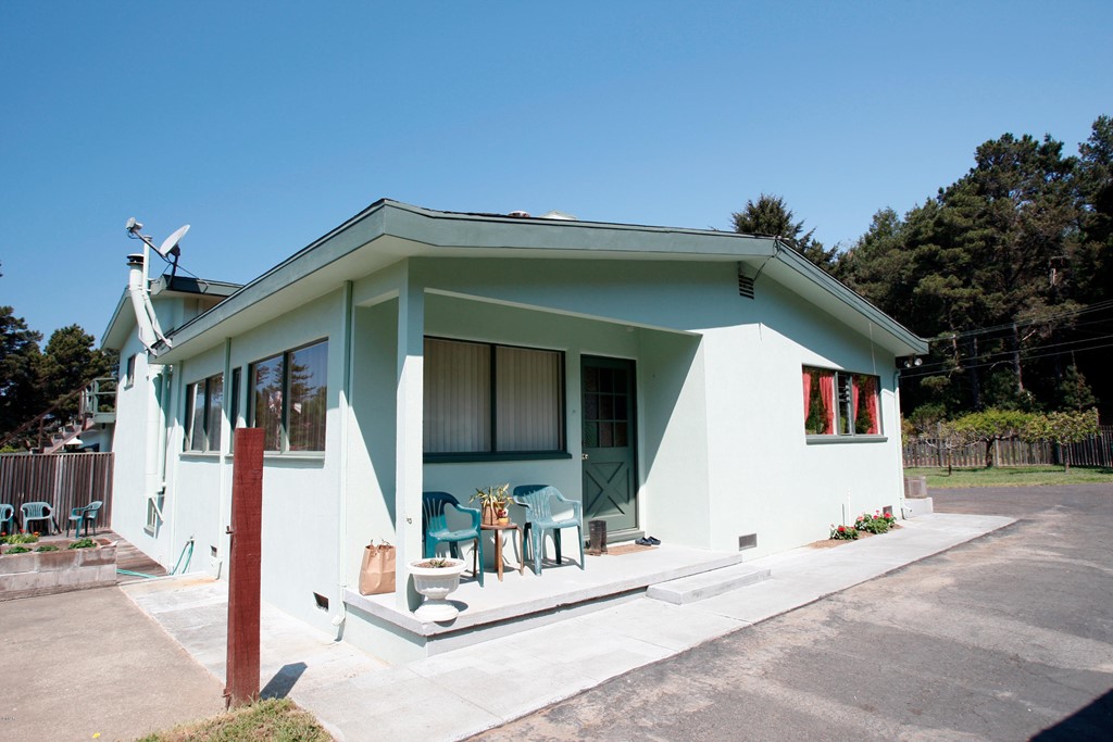 a view of house with outdoor space and porch