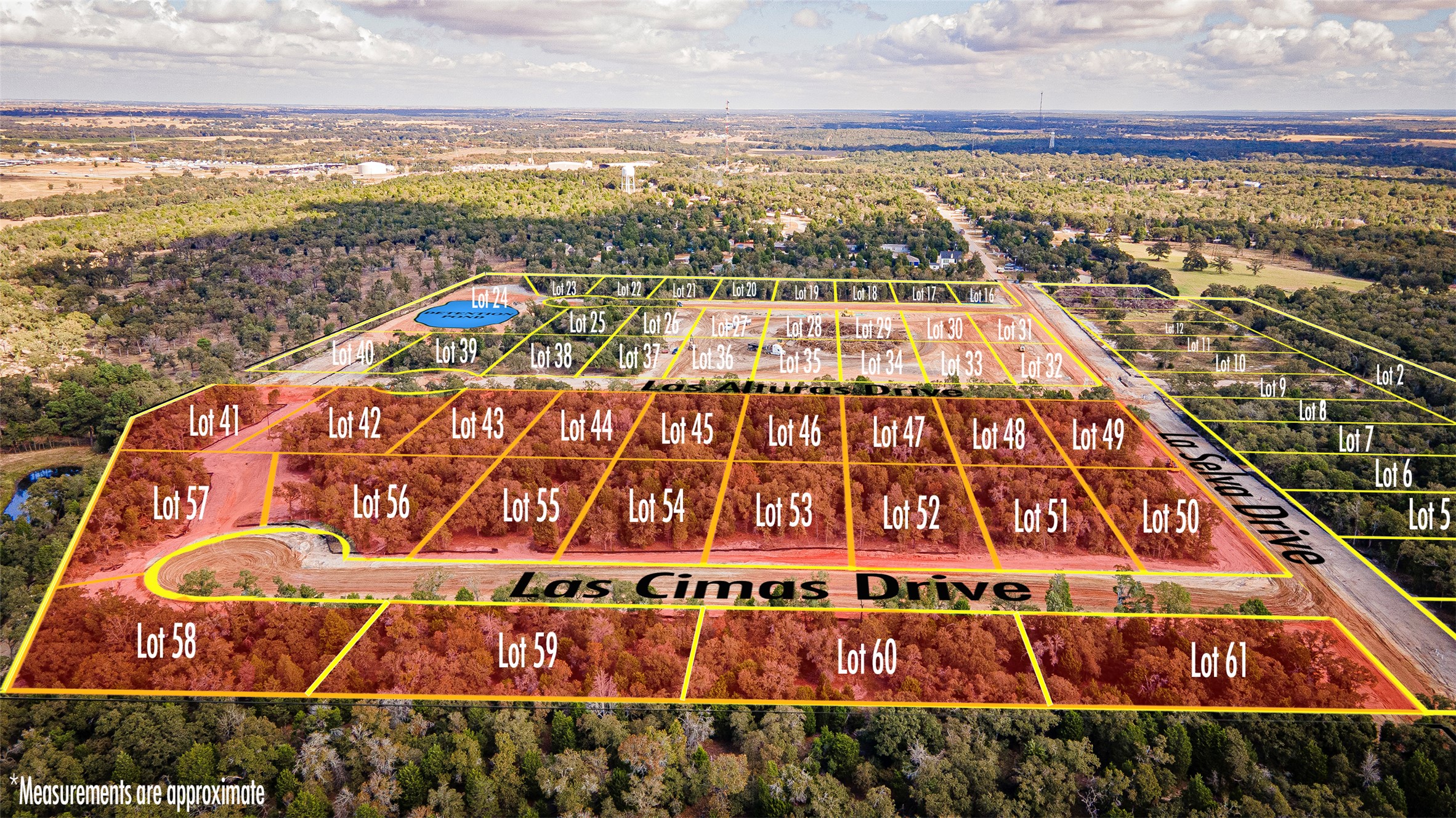 113 Las Alturas Drive Elgin, TX 78621 - Photo 2 of 5 An aerial perspective reveals a vast land development, showcasing numerous plotted lots and newly constructed roadways.