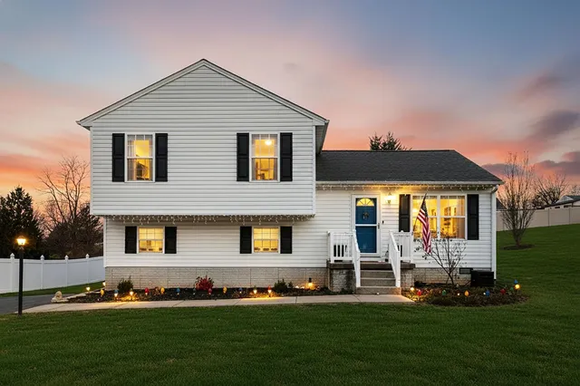 a front view of a house with a yard