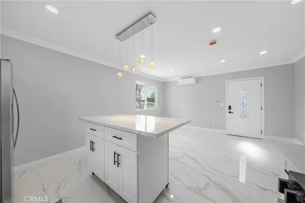 a kitchen with a sink and a refrigerator