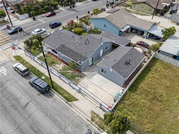 an aerial view of a house with a yard basket ball court